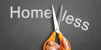 Scissors cutting the word "homeless" in half