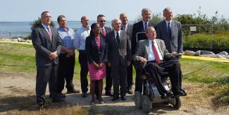 A group of people in suits posing for a photo